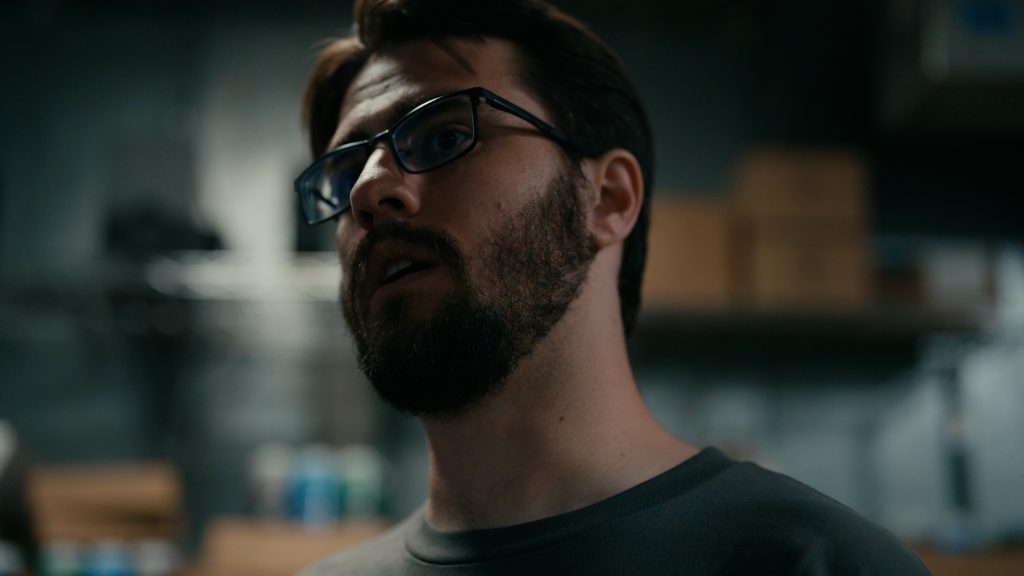 Man in walk-in refrigerator